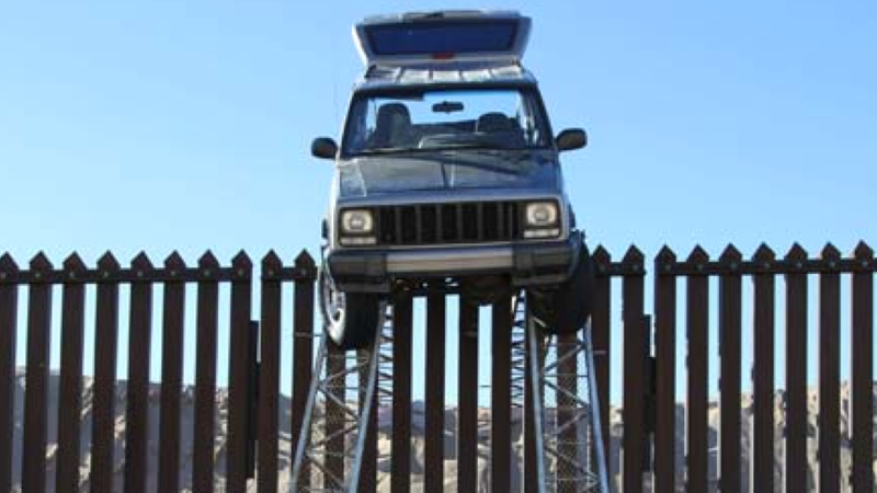 Illustration for article titled The U.S. Border Patrol Found This Jeep Stuck On Top Of The Border Fence